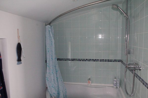 Bathroom with corner bath and shower