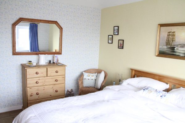 Bedroom 1 with double bed and pine chest of drawers