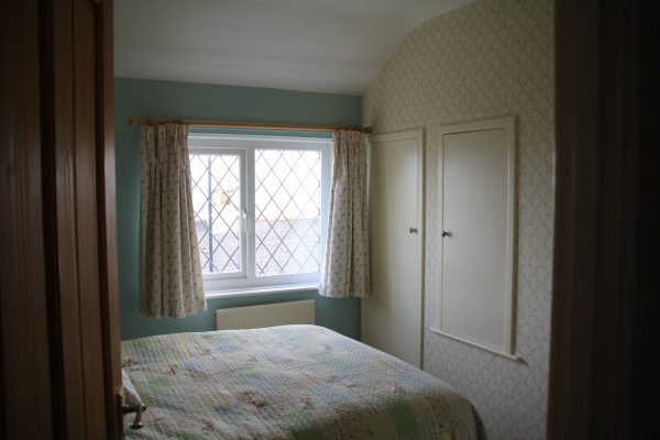 Bedroom 2 with window and fitted wardrobe