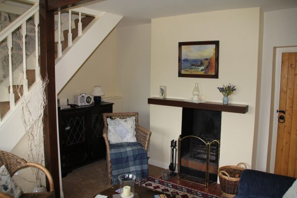 Lounge with fireplace and armchair